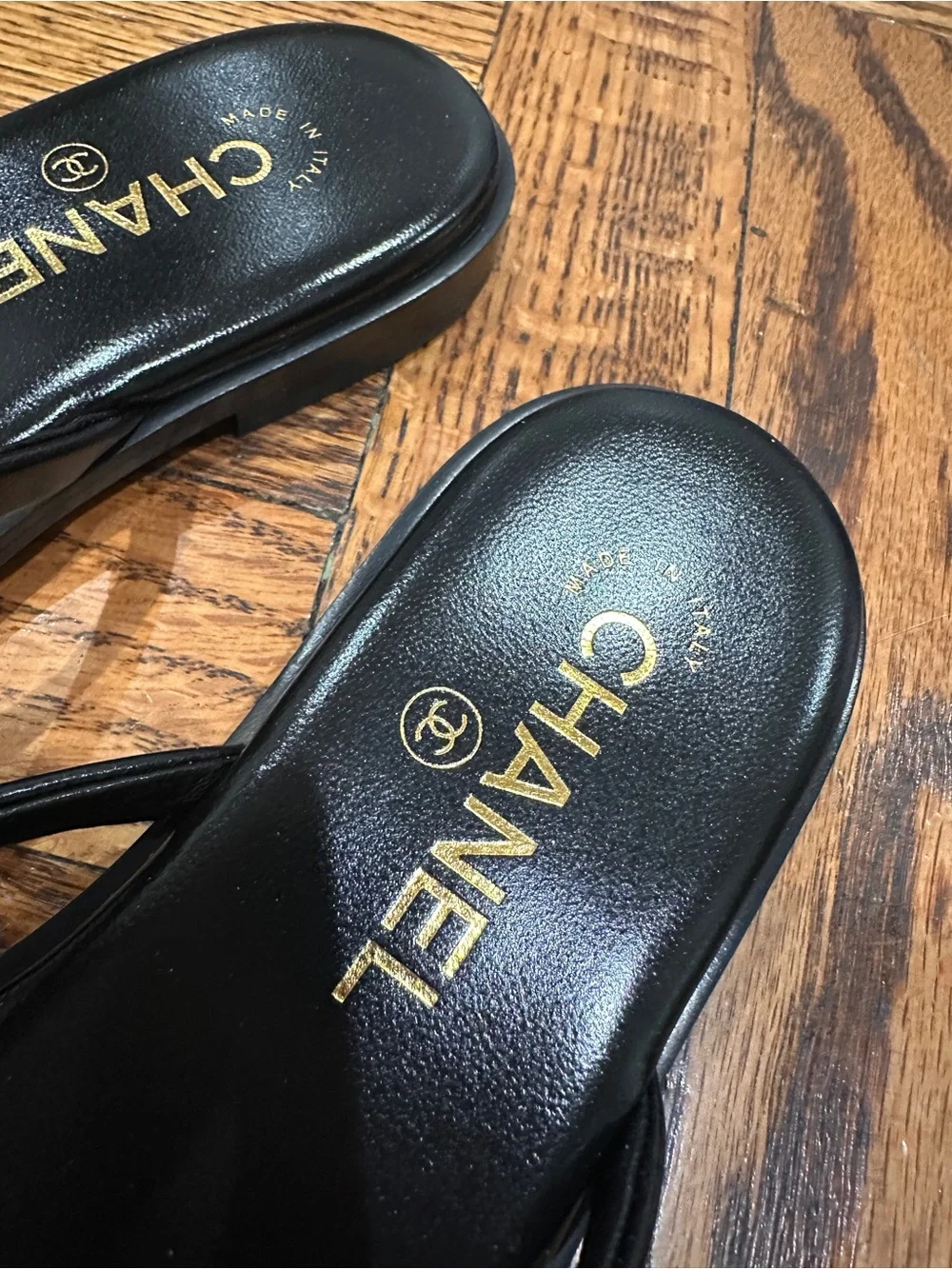 CHANEL Black Leather Logo Thong Sandals with Gold Accent